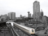 The Skytrain moves against Vancouvers skyline