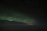 Aurora Borealis, Anchorage illuminates the clouds below....