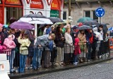 The crowd waits in the rain