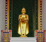 Small Buddha image outside temple