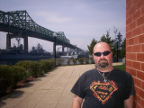 Self-portrait at the State Park building, with the Braga and Battleship Cove in the distance.