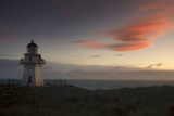 Windy sunset at Waipapa Point, Southland, New Zealand