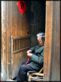 A lady is making some handicrafts for sale
