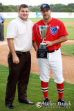 Jamie Toole, CEO of the South Coast League, presents Music Coach Phil Plantier with the Peach State Series Champions trophy.