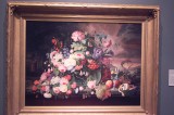 Deverin Roesen  Still Life of Flowers and Fruit with a River Landscape in the Distance 1867