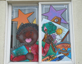 young artist in a window