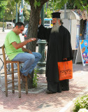Greek Orthodox Priest and Vendor.jpg