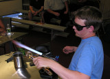 Preparing glob of hot clear to encase with
