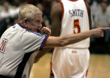 The referee signals the call