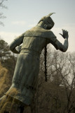 Statue of Noccalula stands over the cliff by falls