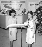 1965 - Carol Blum, Miss Florida 1965, next to a National Airlines B727 model