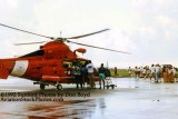 1992 - Coast Guard operations after Hurricane Andrew - HH-65 and volunteers loading supplies