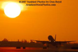 2007 - American Airlines B757-223 takeoff at sunset airline aviation stock photo #3082