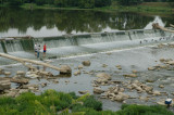 Fishing on a dam in the Stillwater River