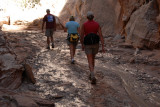 Muddy walking in Cottonwood Wash Narrows