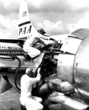 1950 - Engine maintenance on a Pan American Airways Boeing 377 at Miami International Airport