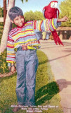 1954 - Seminole Indian boy and parrot at the Musa Isle Indian Village on the Miami River