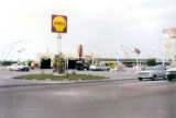 1965 - Uhligs' Shell gas station at 6700 Bird Road in front of the Kwik Chek shopping center, Miami