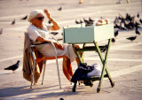 Bird-seed vendor, Piazza San Marco, Venice, 1982.