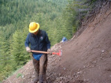 Joe Russell clearing slide area trail to Norse Peak from Half Camp