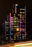 Colorful highrise building at night