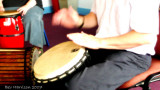 playing the djembe