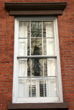 Residence Window with Church Reflection