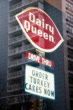 Dairy Queen Sign  with Window Reflection of LaGuardia Place Residences
