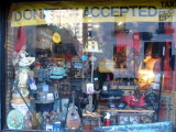 Thrift Shop Window with Reflection of MacDougal Mews