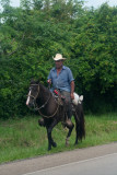 Campesino riding down the road