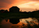 SUNSET SILHOUETTE OF A HOUSE