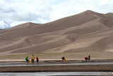 WALKING IN THE RIVER AT THE BASE OF THE SAND DUNES