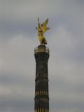 the larger gilded lady on top stands 8.3m tall, predictably represents the goddess of Victory