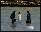 Boy taking a bath with his sisters - Oman 2004