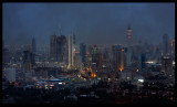 Heavy rainclouds hanging low over Kuwait city skyline