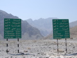 Dual Road Signs Khasab Oman.JPG