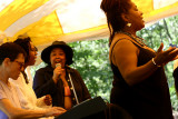 Aleah Long conducting, Esther Blue on keyboards, Deirdre & Yaniyah singing