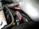 Brake wire harness leading to rear brake wire switch can be accessed from behind tank