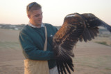 man feeding eagle