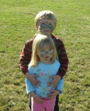 Alex and Abby were out playing ball with their dad. They got their faces painted today.