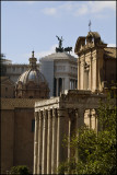 Foreground, Temple of Antoninus and Faustina incorporated into the church of San Lorenzo of Miranda. Victor Emmanuel in back