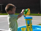 note his wet shirt and the direction the water is falling