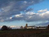 farm under storm clouds