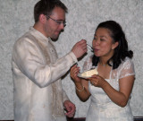 Bride and groom eat cake1 pc.jpg