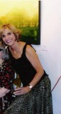 Taken at an art show in Santa Fe that had some of my paintings in it.  The one partially shown in the background is one of mine.