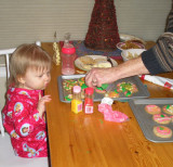 Astrid decorating cookies with Gaylen