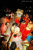 lion dance troupe leader receiving blessings