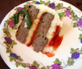 a slice of meatcake heaven (green thing = bean, not worm!)