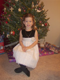 Paige in front of Christmas tree