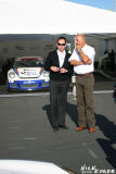 Bobby Rahal and someone from Porsche Motorsports